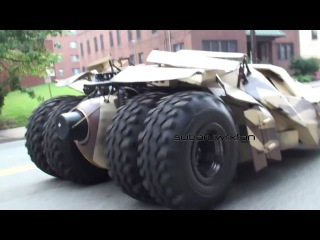 3 tumblers (batmobile) driving on the streets